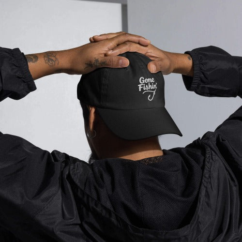 Man wearing a hat with a fishing design embroidery