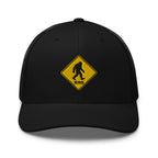 Bigfoot crossing sign embroidered black trucker hat front view – funny outdoor hiking cap