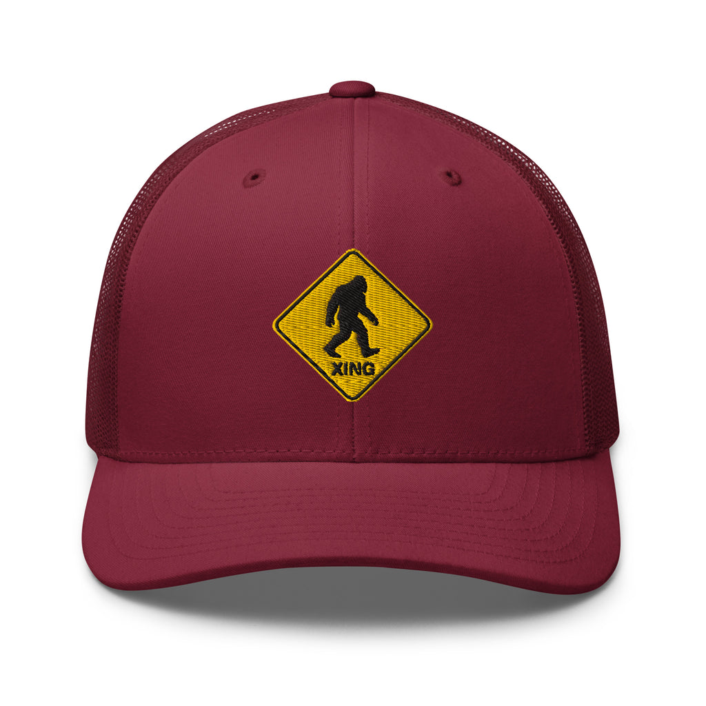 Bigfoot crossing sign embroidered cranberry trucker hat front view – funny outdoor gift hat