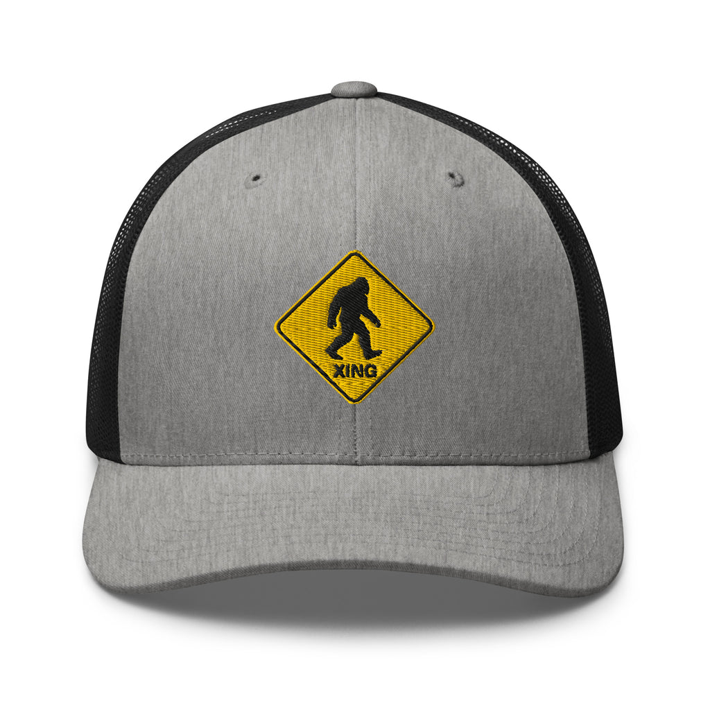 Bigfoot crossing sign embroidered gray heather trucker hat black mesh front view – funny outdoor cap