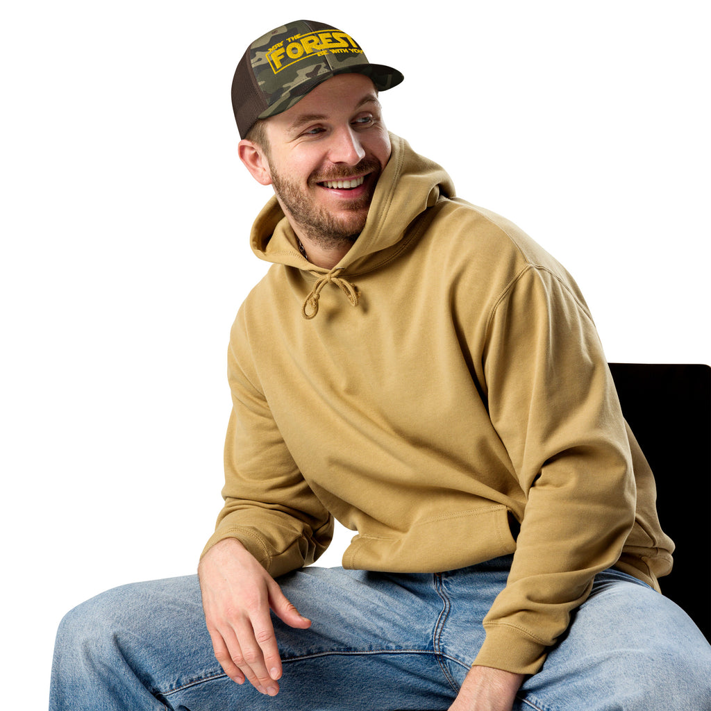 Man wearing May the Forest Be With You camo trucker hat outdoors – funny hiking cap